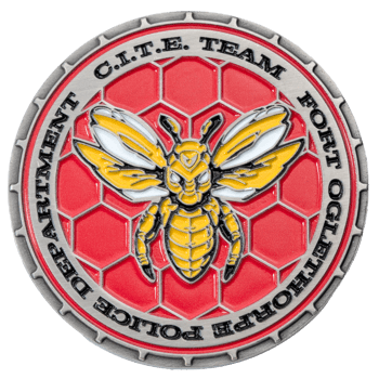 A silver challenge coin featuring a yellow and white hornet over a red honeycomb background, inscribed with Fort Oglethorpe Police Department C.I.T.E. Team.