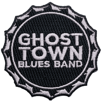 Circular embroidered patch for Ghost Town Blues Band featuring white text on a black background with a jagged edge border.