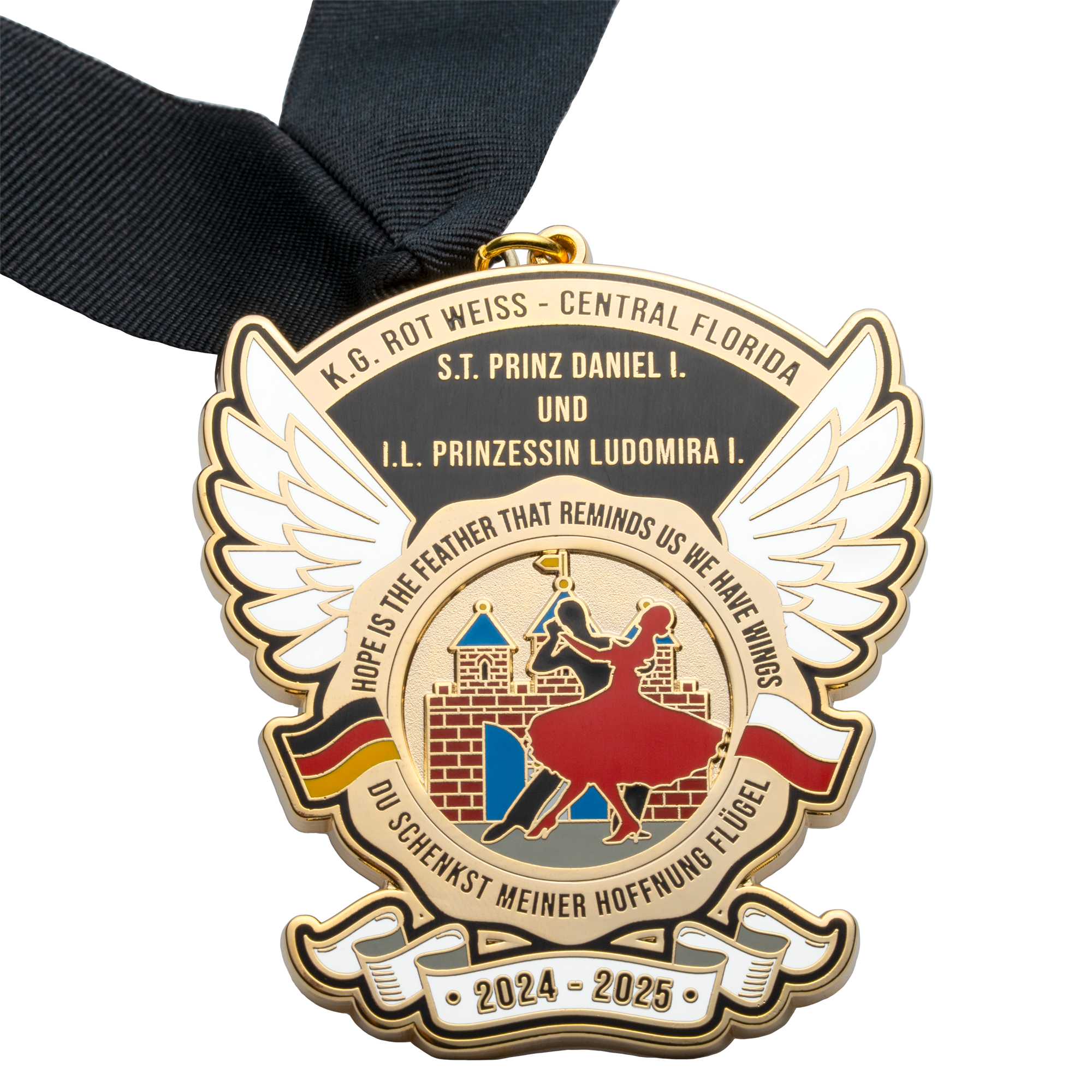 Gold-plated medal with wings, ballroom dancers, and a castle featuring a black neck ribbon.