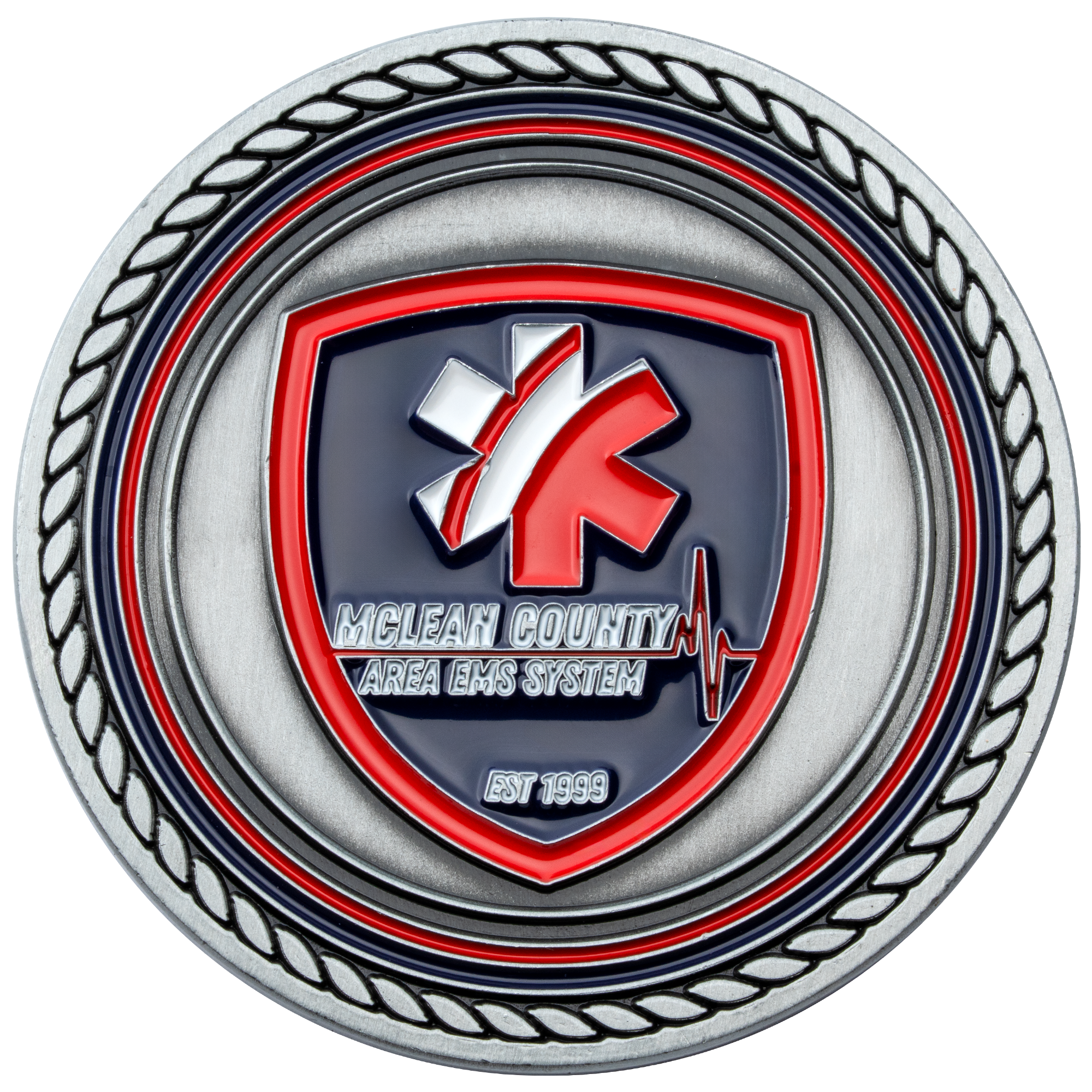 Antiqued silver challenge coin featuring a red and blue shield with a Star of Life and McLean County Area EMS System text.