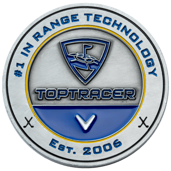 Antiqued silver Toptracer challenge coin with blue and yellow enamel accents, featuring the Toptracer logo and Est. 2006 text.