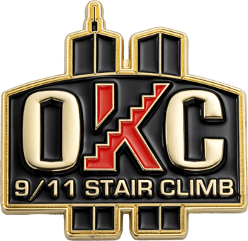 OKC 9/11 Stair Climb lapel pin with Twin Towers silhouette and gold lettering.