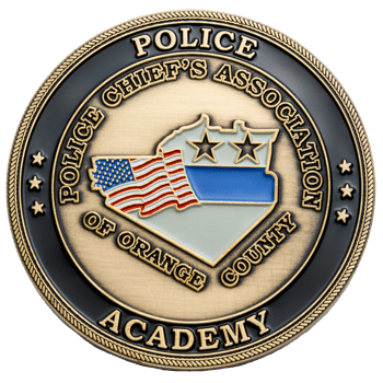 Police Chief's Association of Orange County Academy challenge coin with American flag and thin blue line map design.