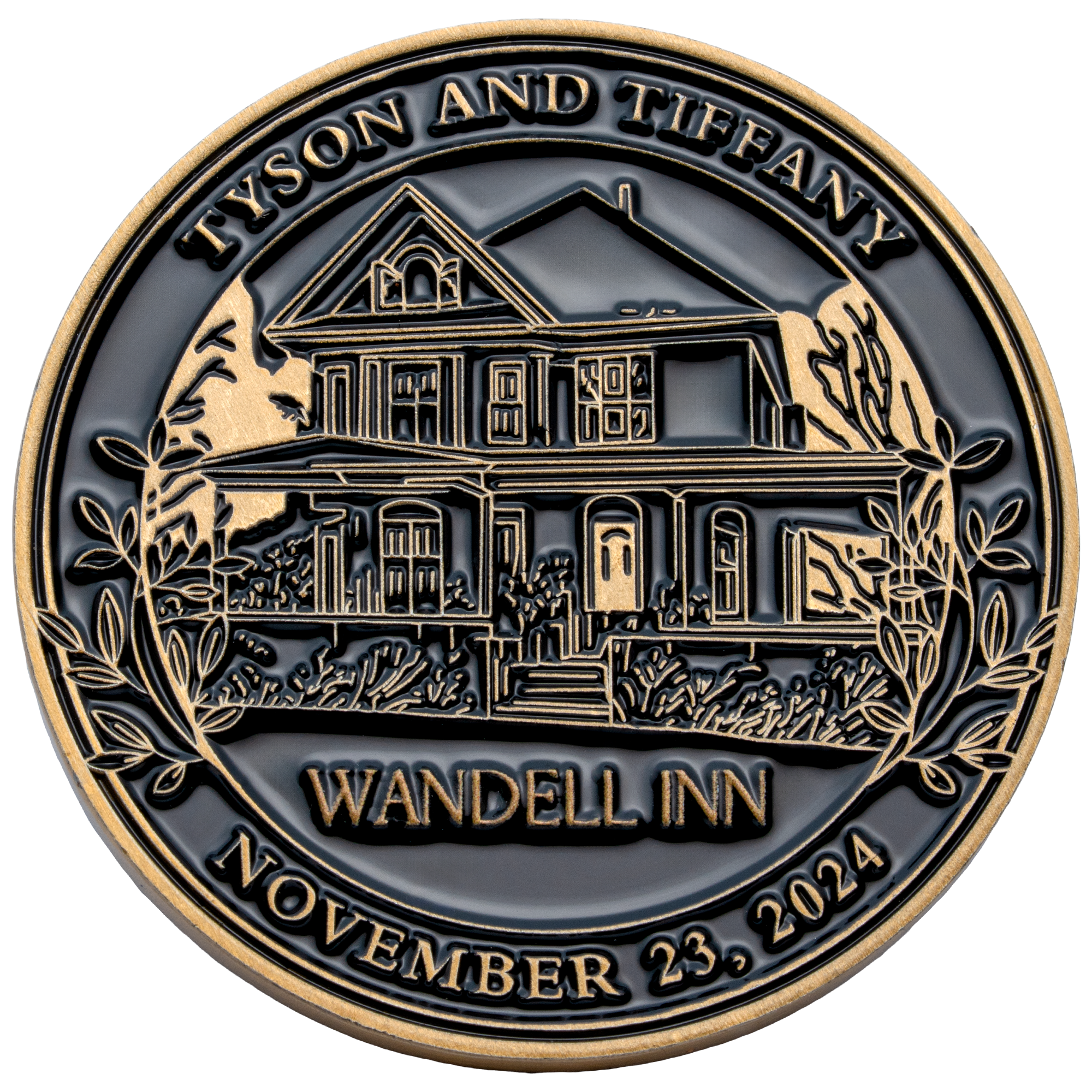 Circular challenge coin featuring an architectural illustration of the Wandell Inn house with gold text and borders on a black background.