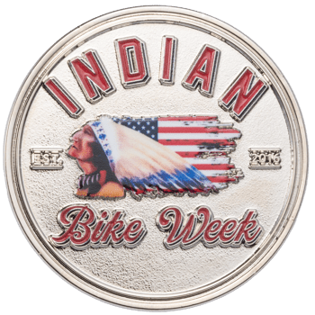 Silver challenge coin with 'Indian Bike Week' text, a profile of a Native American in a headdress with an American flag pattern, and 'Est. 2016'.