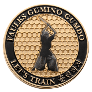 Circular challenge coin featuring a martial artist with a sword over a gold honeycomb pattern, inscribed with Faulks Gumino Gumdo and Let's Train.