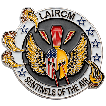 Circular challenge coin featuring a winged Spartan helmet with American flag patterns, lightning bolts, and the text LAIRCM Sentinels of the Air.