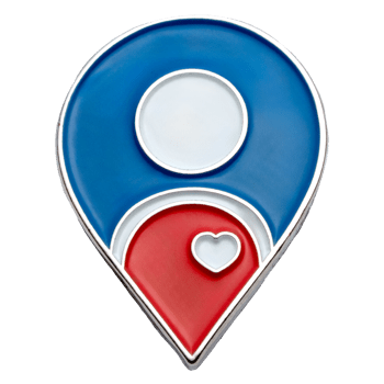 Map pin shaped lapel pin with blue, red, and white enamel and a small silver heart detail.