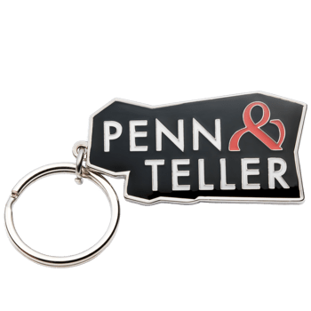 Penn & Teller keychain with white lettering and a red ampersand symbol on a black enamel background.