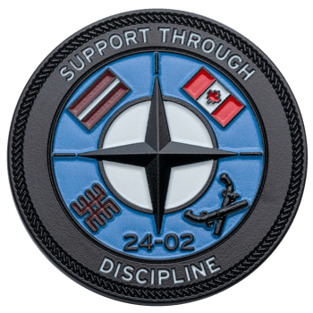 Circular challenge coin featuring the NATO star emblem, Latvian and Canadian flags, and the text Support Through Discipline and 24-02.