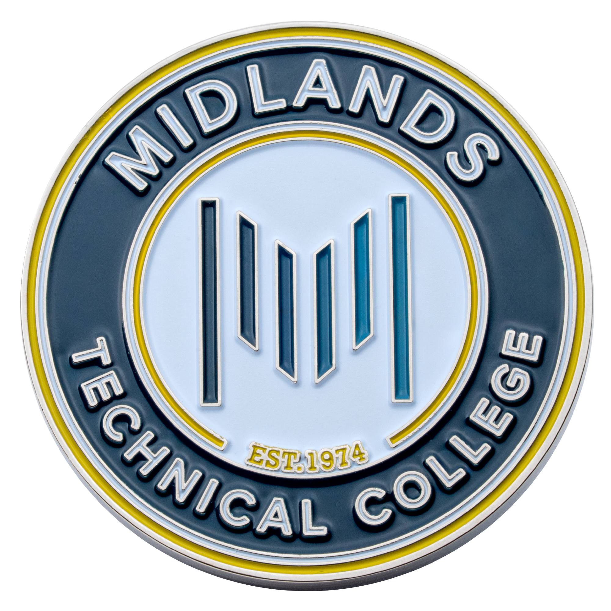 Circular Midlands Technical College challenge coin with blue and yellow enamel, featuring a stylized M logo and Est. 1974 text.