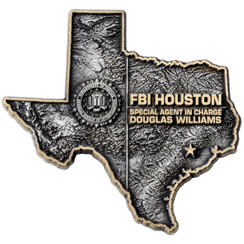 Antiqued silver Texas-shaped challenge coin featuring the FBI seal and text for FBI Houston Special Agent in Charge Douglas Williams.