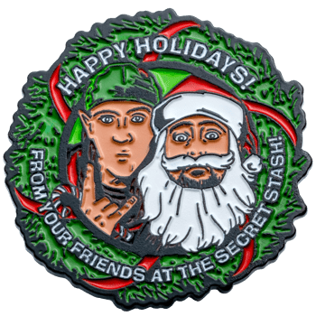 Enamel lapel pin featuring Jay and Silent Bob as an elf and Santa Claus surrounded by a green holiday wreath with the text Happy Holidays.