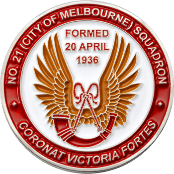 Circular challenge coin for No. 21 Squadron featuring a golden winged emblem, red horn, and white background surrounded by a red border with text.
