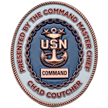 Oval challenge coin with a USN anchor, rope border, and blue and white enamel, presented by Command Master Chief Chad Coutcher.
