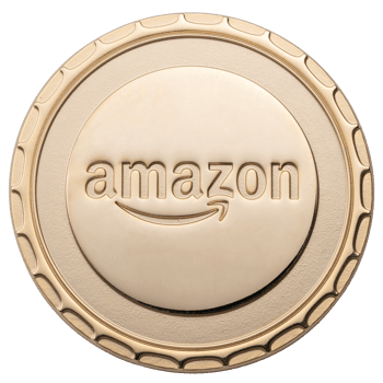 Gold challenge coin featuring the Amazon logo with a smile arrow and a scalloped edge design.