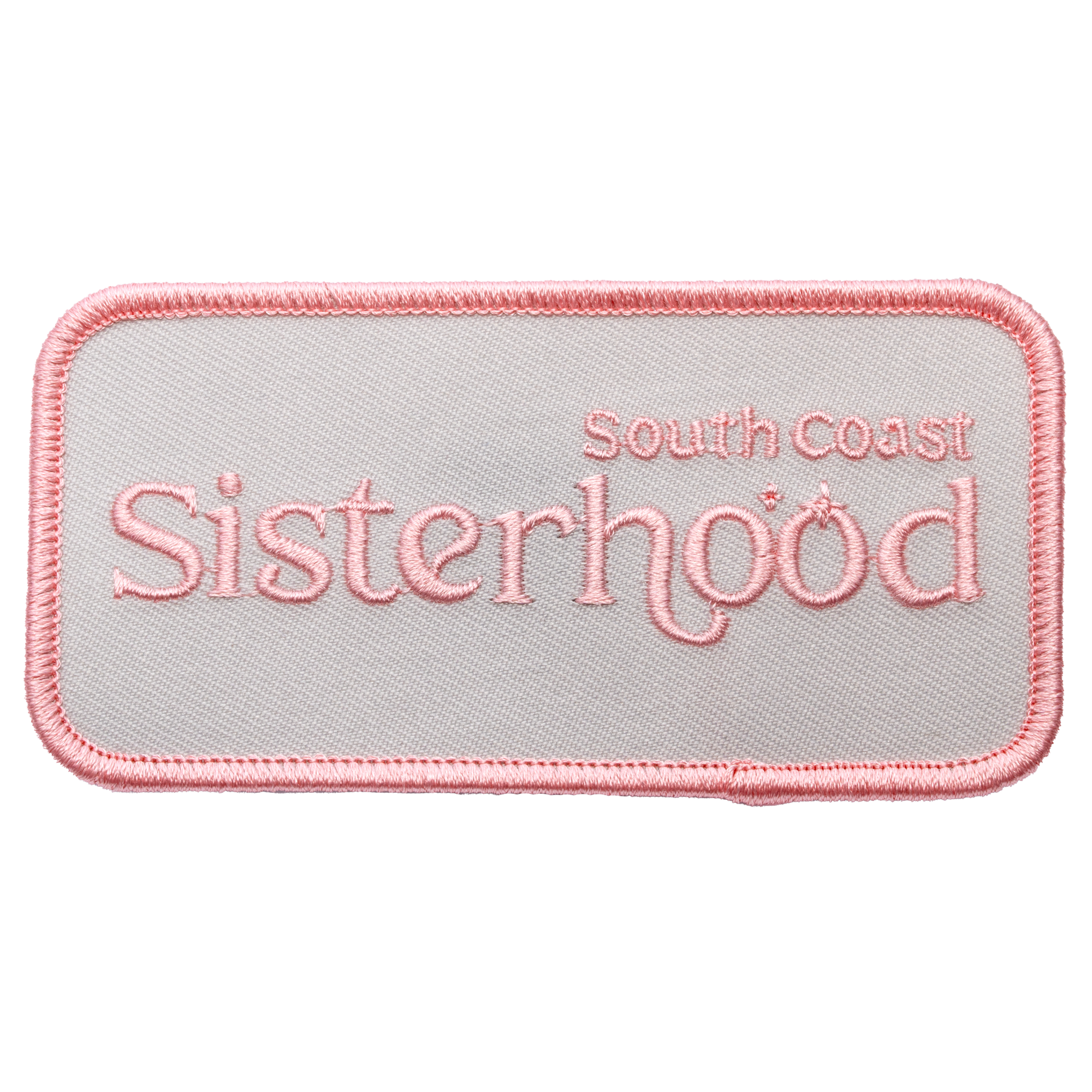 Rectangular embroidered patch with South Coast Sisterhood text in pink thread on a light grey background with a pink merrowed border.