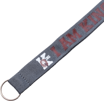 Gray fabric keychain strap with red embroidered I AM KING text and a white letter K featuring a lion head logo.