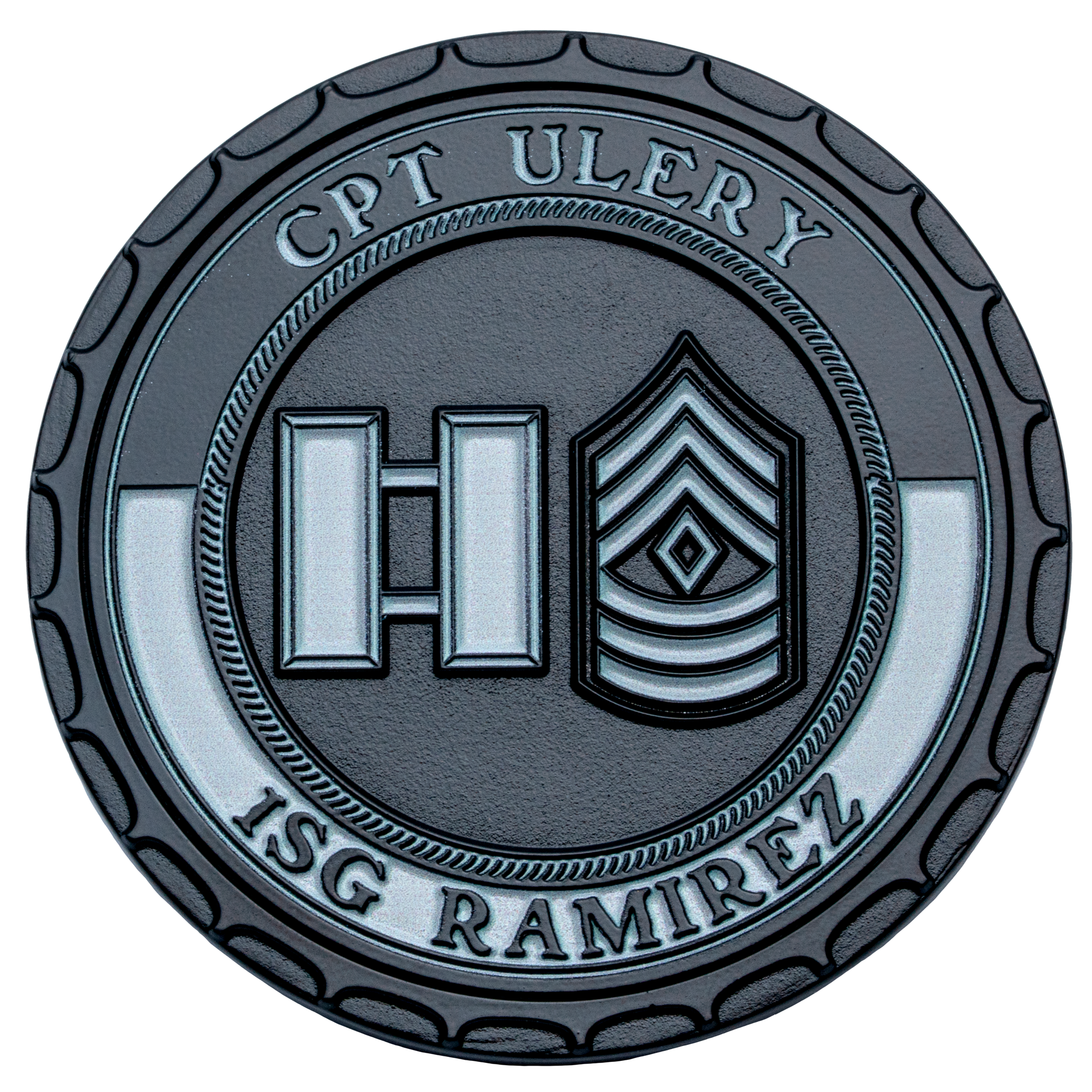 A black and silver challenge coin featuring Captain and First Sergeant military rank insignias with the names CPT Ulery and 1SG Ramirez.