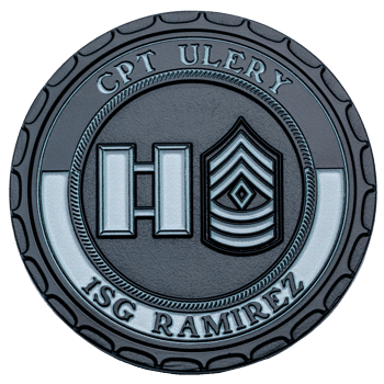 A black and silver challenge coin featuring Captain and First Sergeant military rank insignias with the names CPT Ulery and 1SG Ramirez.