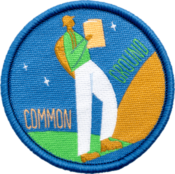 Circular embroidered patch with blue, green, and orange featuring a figure walking with a map and text reading Common Ground.
